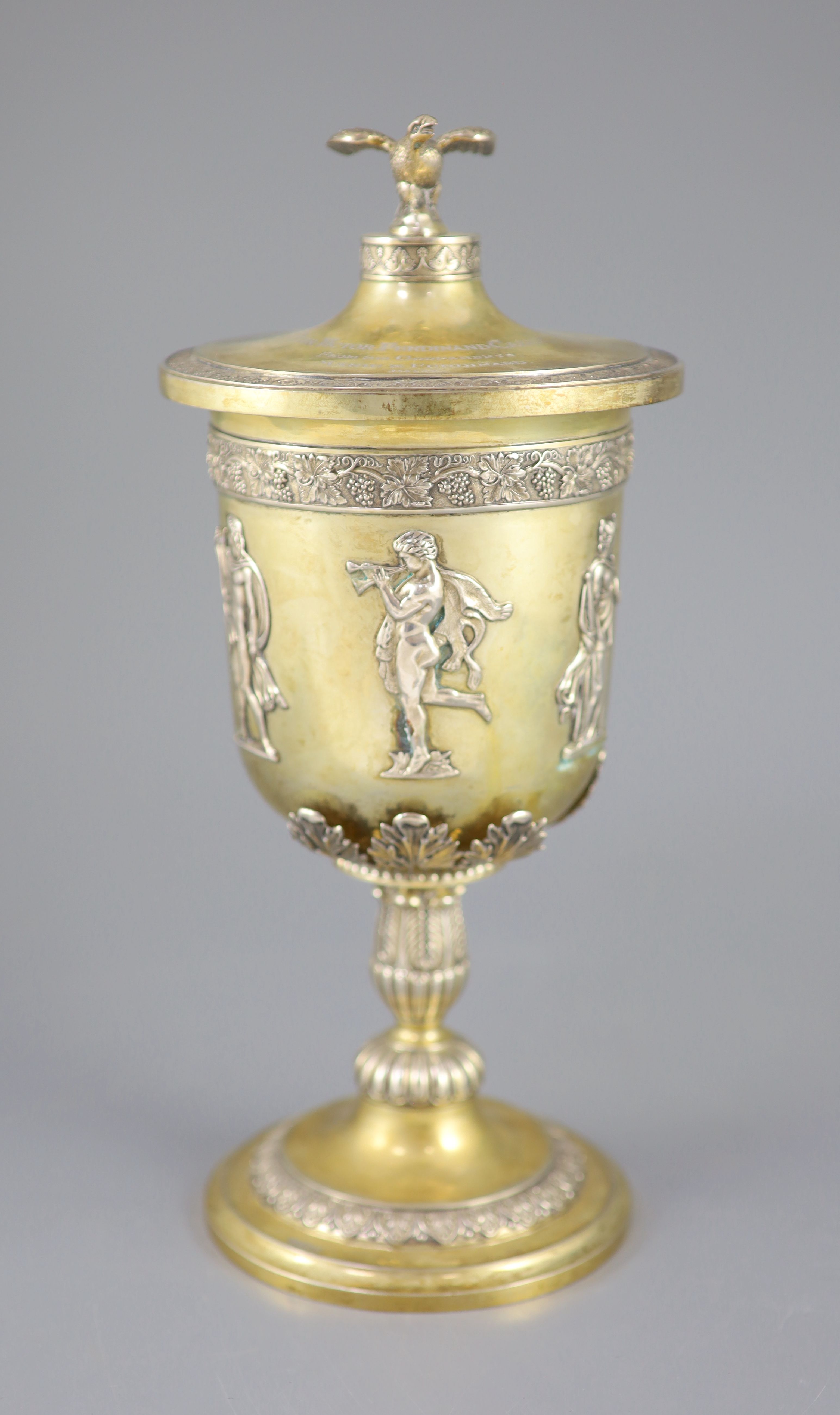 A late 19th/early 20th century German parcel gilt 800 standard presentation pedestal cup and cover, by Wollenweber,